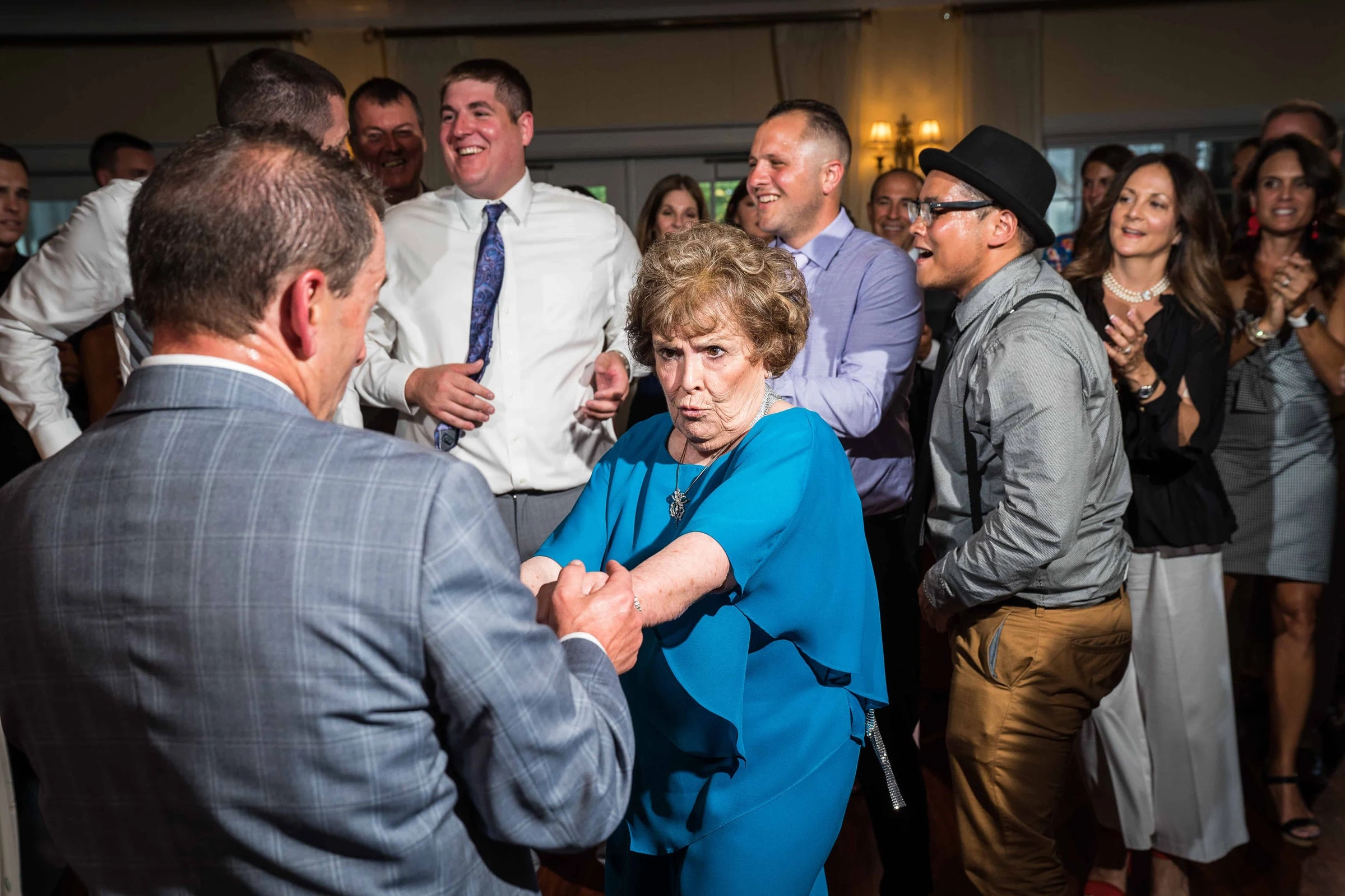 Guests of different generations dancing together at a reception